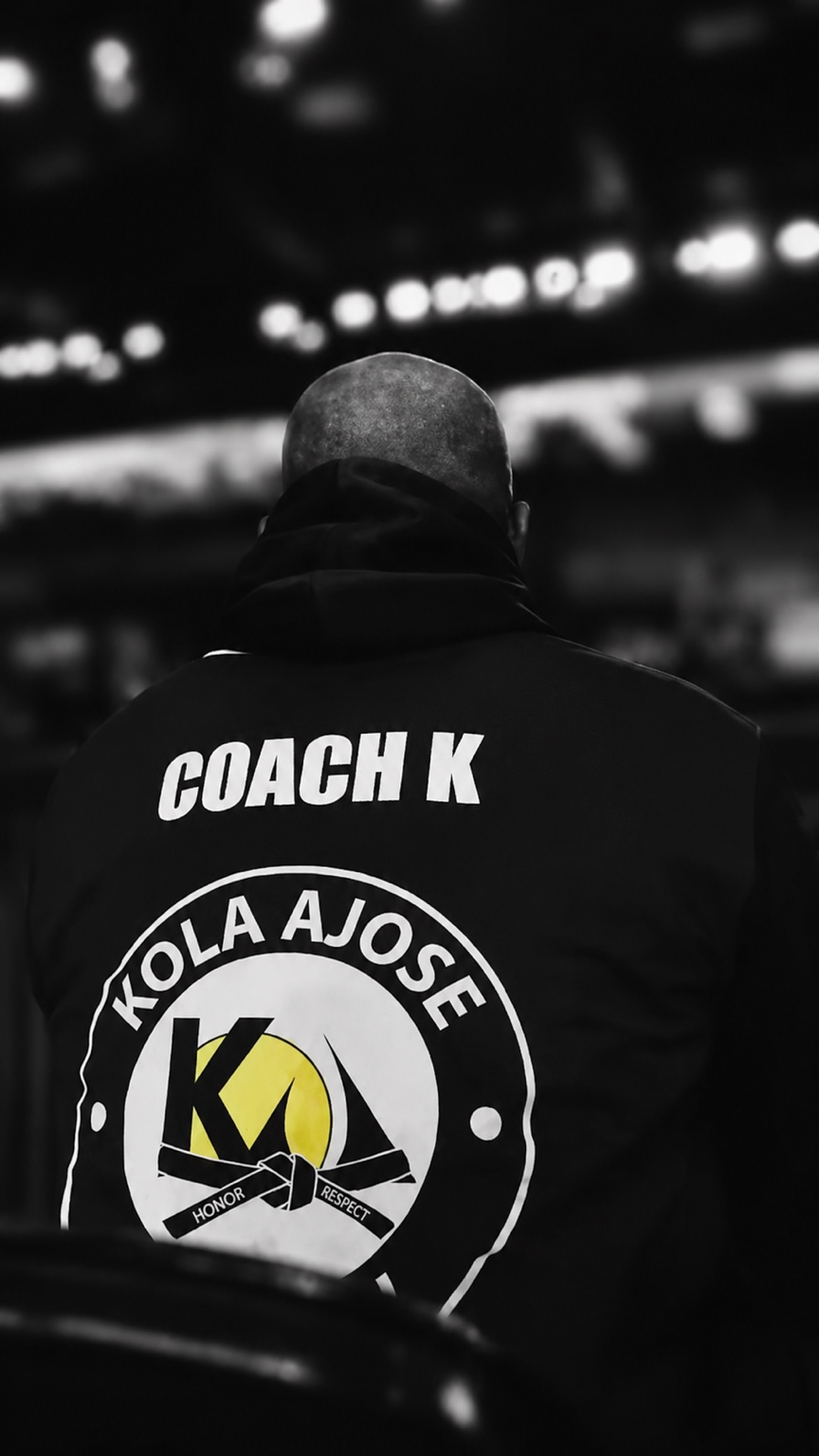 Coach Kola Ajose overlooking the competition floor